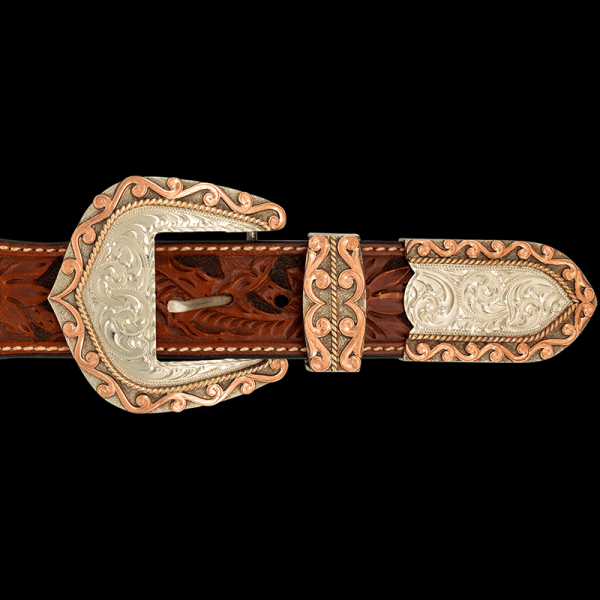 The Auburn Three Piece Buckle Set is the perfect simple, yet elegant absolute Western Set. Features a hand engraved base with copper scrolls frame and bronze rope accents.  Order now!